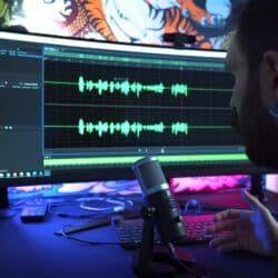 man in front of computer monitor